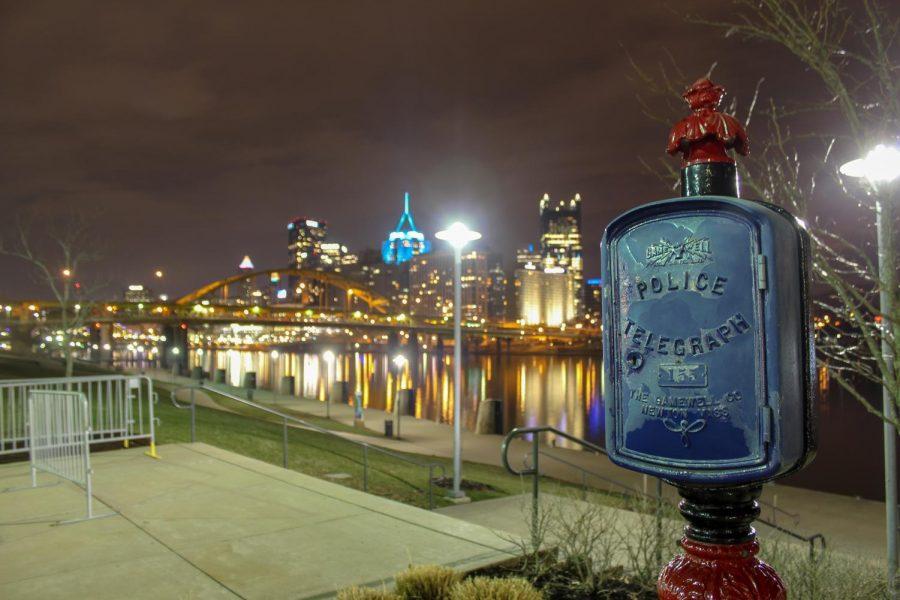 A historical marker of a police telegraph is placed on the North Shore, with Pittsburghs downtown skyline in the background. Photo Date: March 29, 2019 Photo Credit: (RMU Sentry Media/Gage Goulding)