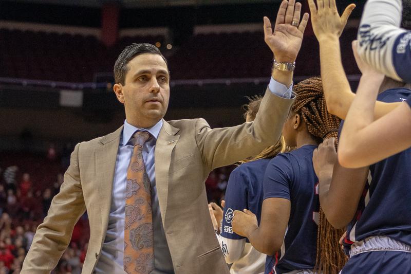 RMU head coach Charlie Buscaglia high fives his teammates as the final seconds wind down in the NCAA tournament. March 27, 2019 Louisville Ky. (Samuel Anthony/RMU Sentry Media)