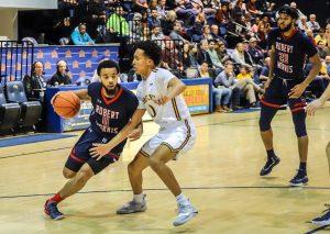 PHILADELPHIA - Josh Williams drives to the hoop against Drexel on 12/01/18. (Photo Credit: David Auth/RMU Sentry Media) Photo credit: David Auth