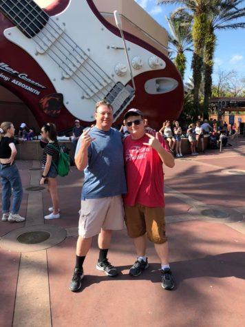 Photo from Disney World in 2019, outside the Rock and Roller Coaster with my dad. Rock music became an important part of my life and helped me deal with my anxiety.