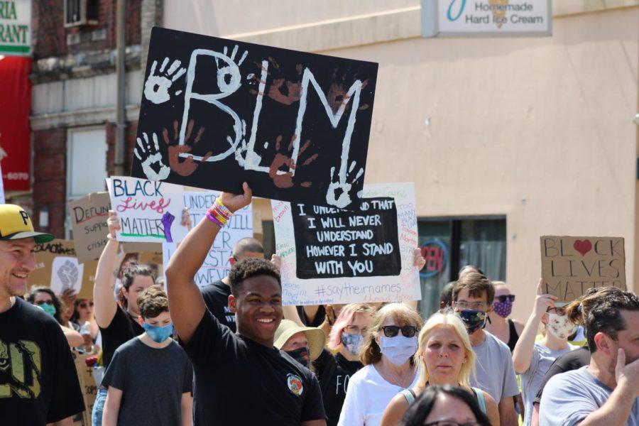 A protester raises his Black Lives Matter sign high in the air. Coraopolis, PA. June 6, 2020. RMU Sentry Media/Garret Roberts 