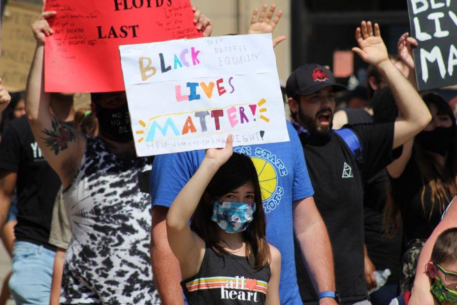 A younger protester carries her Black Lives Matter sign high throughout the march. Coraopolis, PA. June 6, 2020. RMU Sentry Media/Garret Roberts 