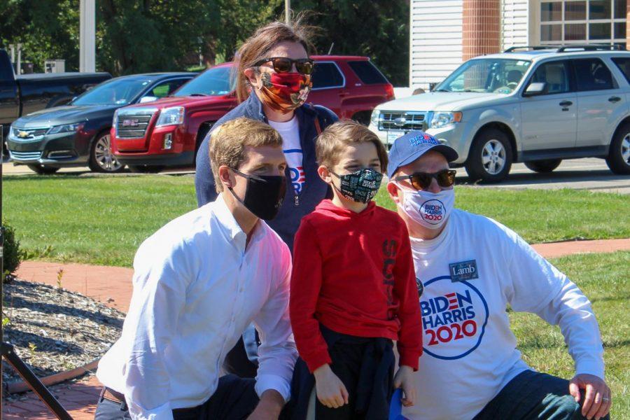Congressman Lamb poses for a photo with a local family.