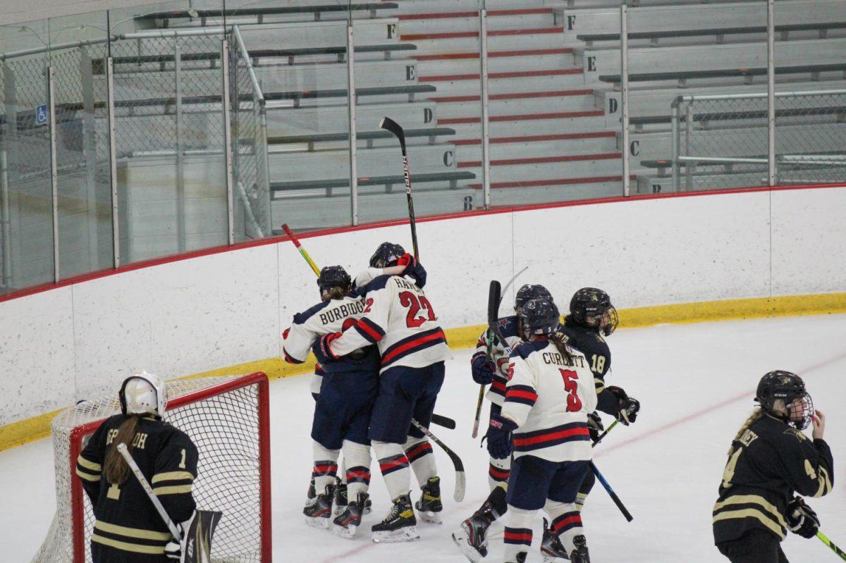 The Colonials celebrate Ellie Marcovskys first career goal, the game-winning goal, on Friday night. Photo Credit: Nathan Breisinger