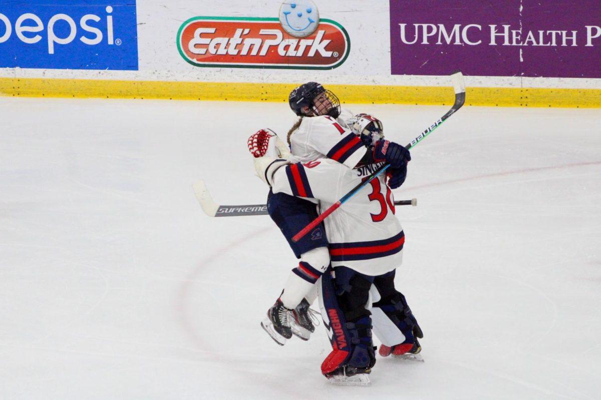 Michaela Boyle embraces Molly Singewald after she recorded her first collegiate shutout in her first career start. Photo Credit: Tyler Gallo