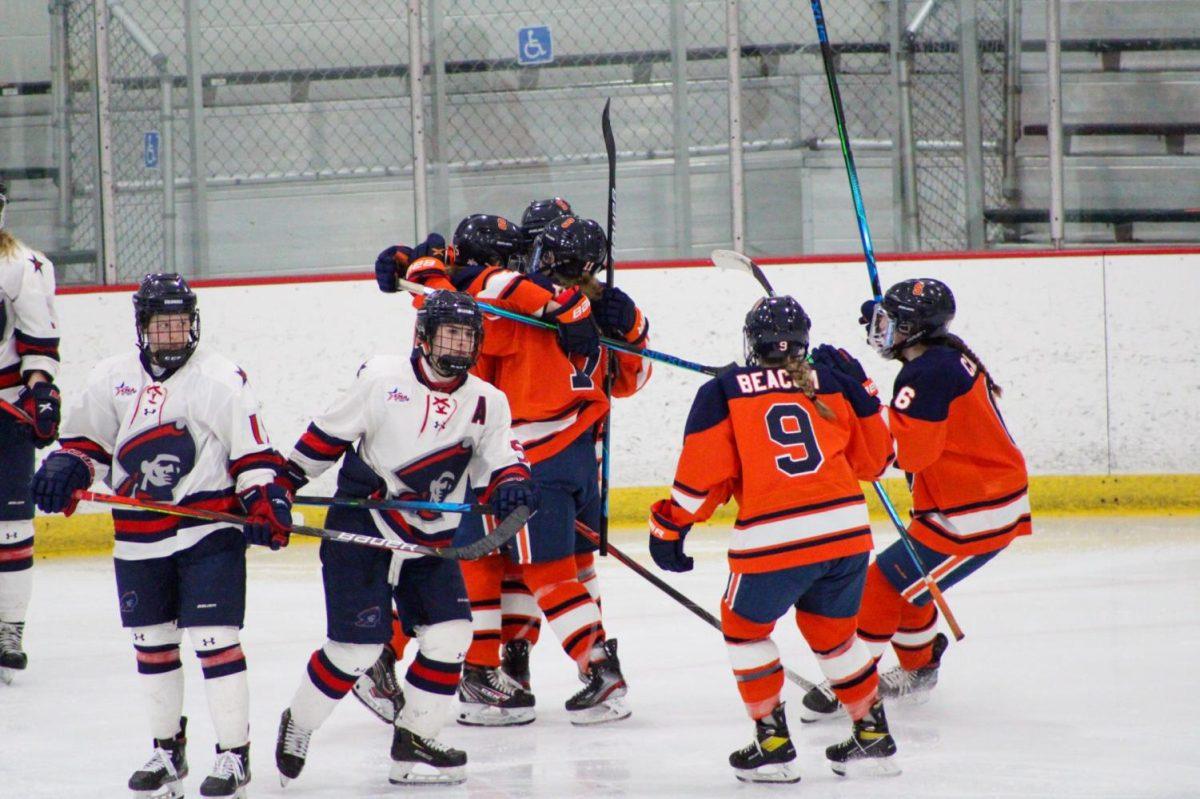 The Orange celebrate Sara Thompsons goal in the second period, the first of four-straight the Orange would score. Photo Credit: Tyler Gallo