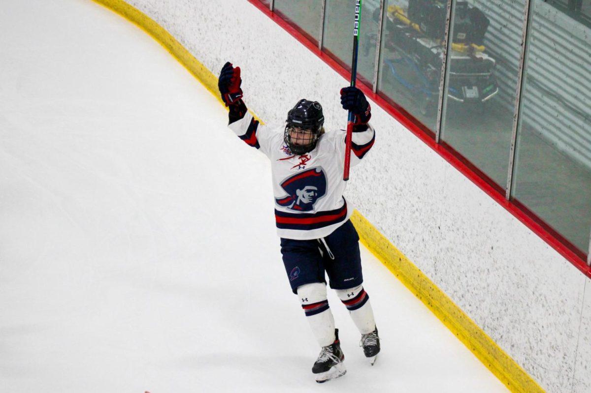 Michaela Boyle celebrates one of her four goals on Sunday as the Colonials dismantled Sacred Heart 8-0. Photo Credit: Nathan Breisinger