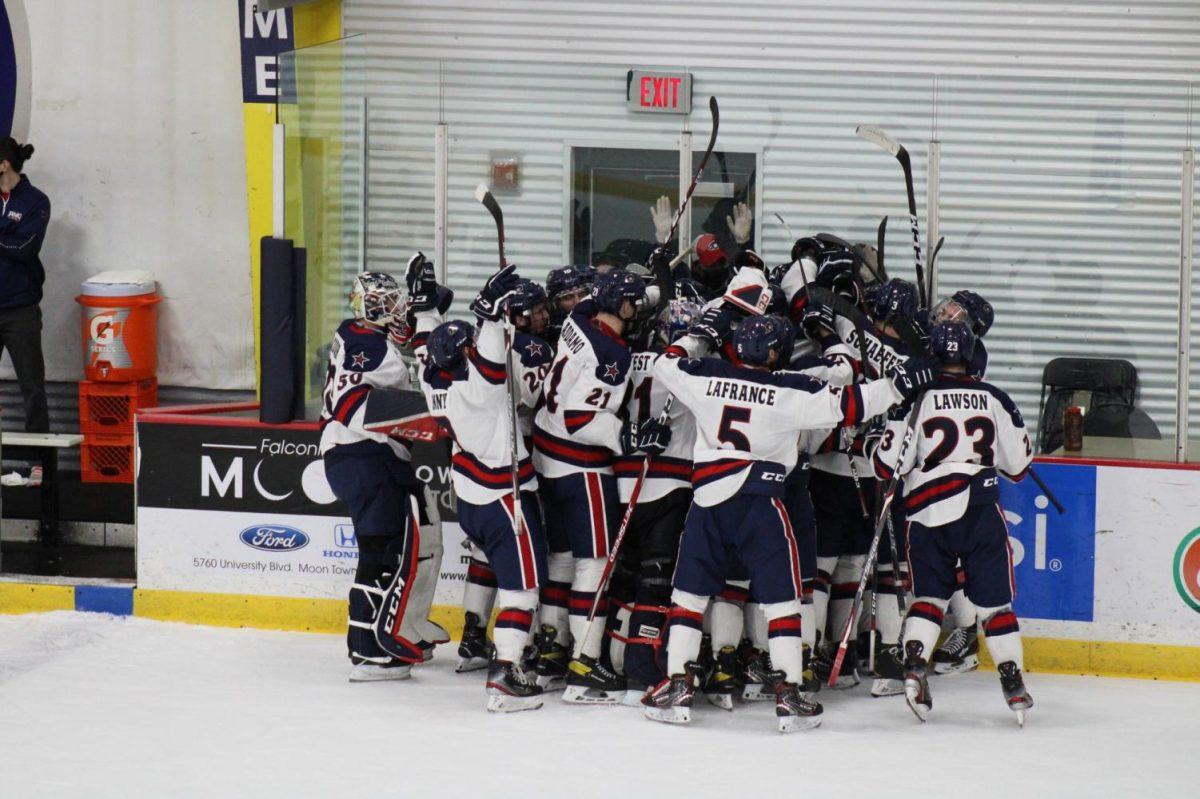 Mens hockey celebrates a regular-season win over Niagara, looking to do the same this weekend. Photo Credit: Nathan Breisinger