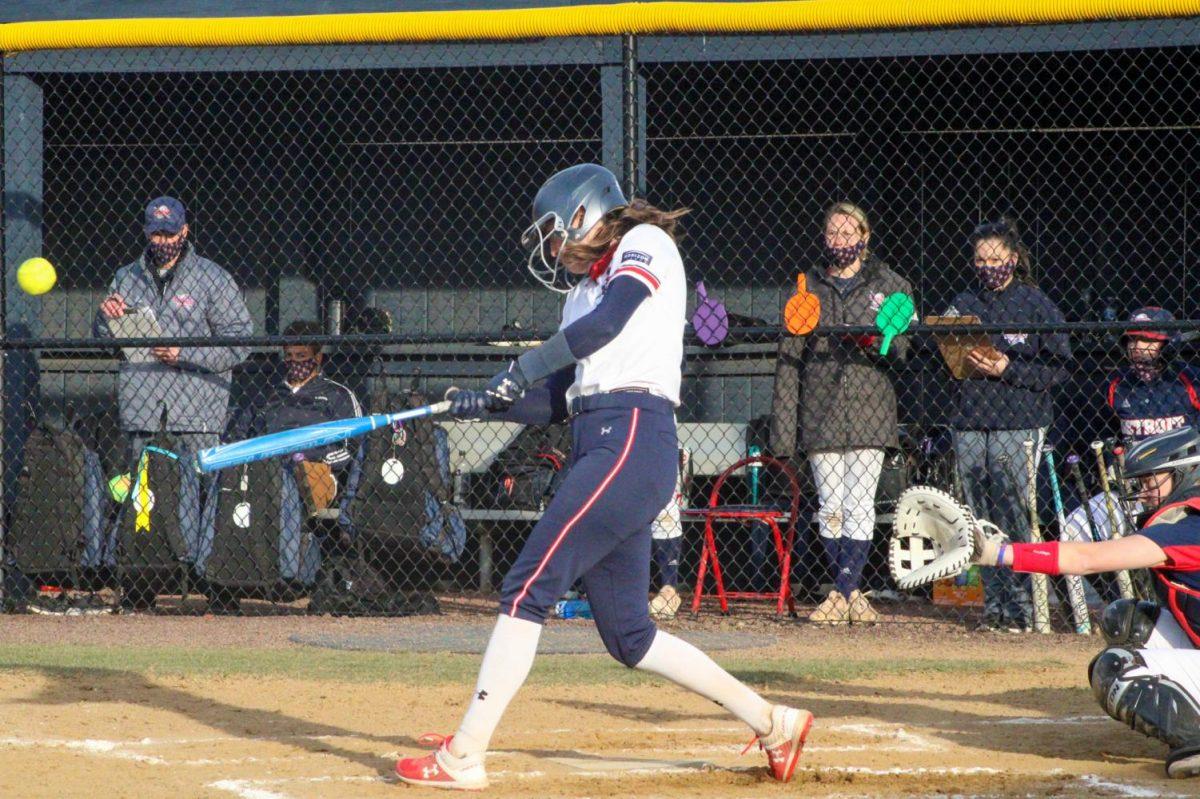 Madison Riggle rips an RBI single in RMUs game two win. She pitched five scoreless innings in the victory while also contributing an RBI. Photo Credit: Tyler Gallo