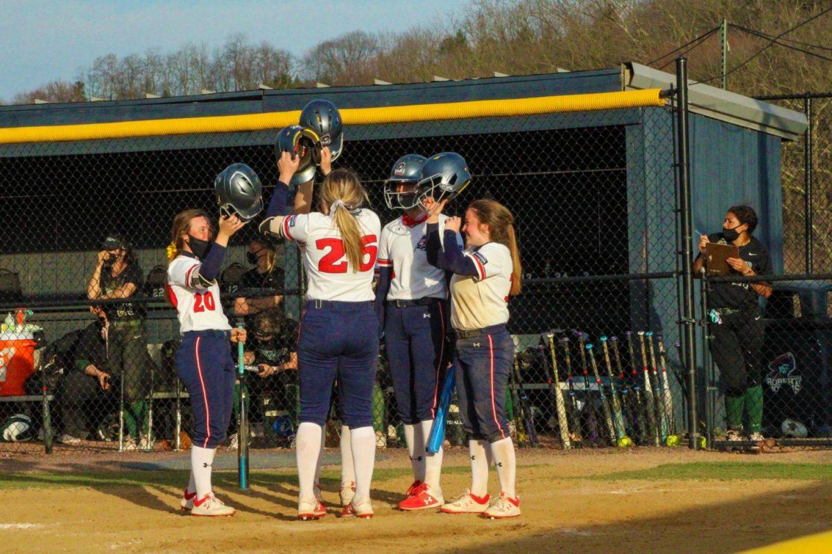 Natalie+Higgins+celebrates+her+grand+slam+in+the+bottom+of+the+fourth+inning+in+the+second+game+on+Tuesday.+Photo+Credit%3A+Tyler+Gallo