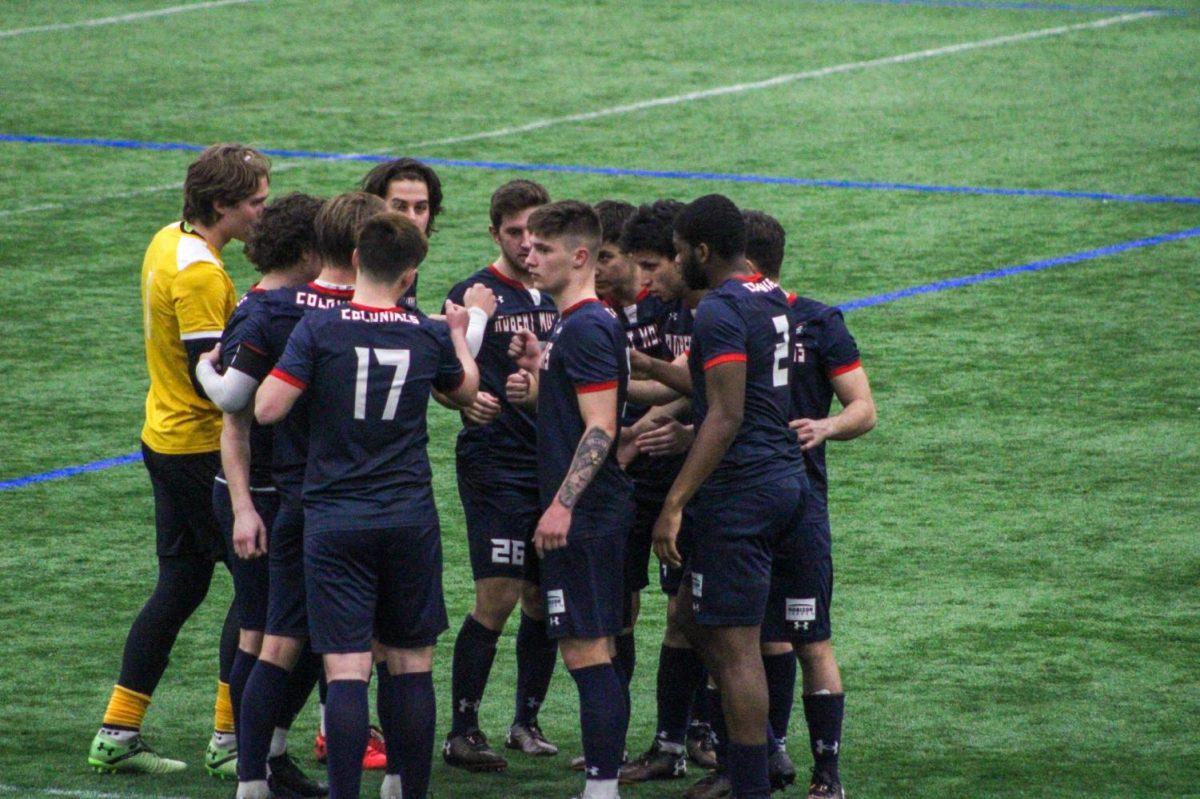 Mens soccer huddles up before taking the field. Photo Credit: Tyler Gallo/Colonial Sports Network
