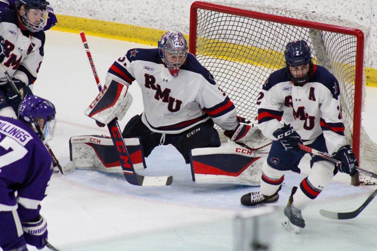 Noah West slides for a save against Niagara in the AHA playoffs. Photo Credit: Nathan Breisinger/Colonial Sports Network