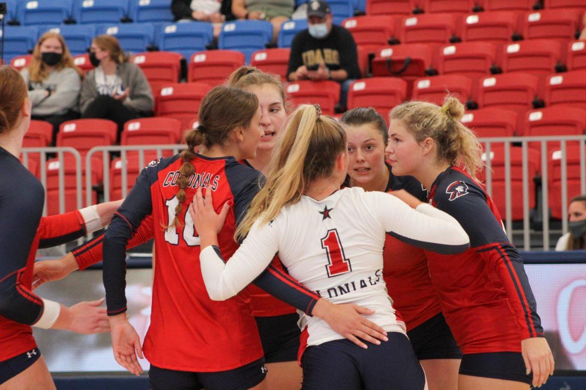 RMU Volleyball comes together after a point for Idaho.