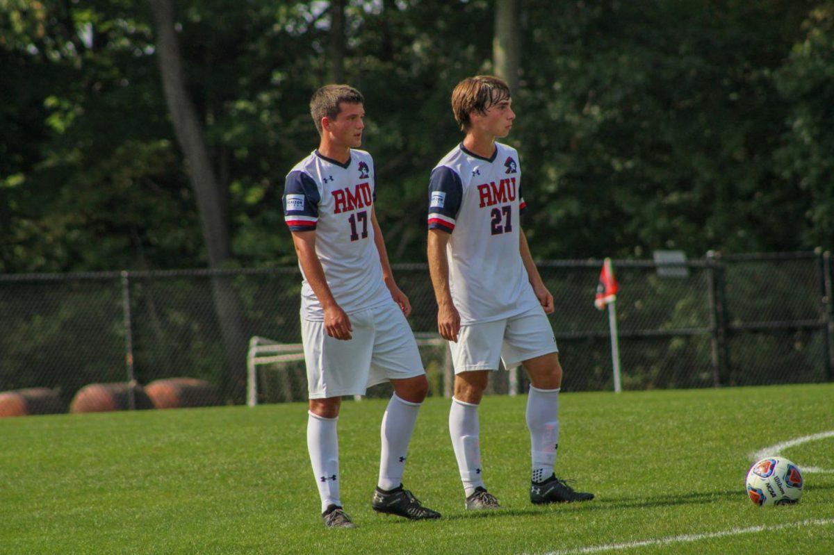 Preston Rushmore (left) and Jacob Haskins (right) strategize a free kick.