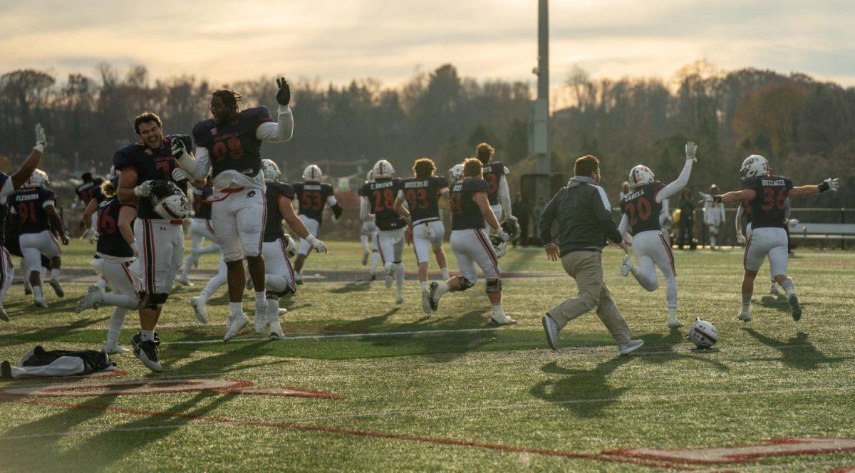 RMU celebrates their overtime win against Campbell on Saturday. Photo credit: Justin Newton