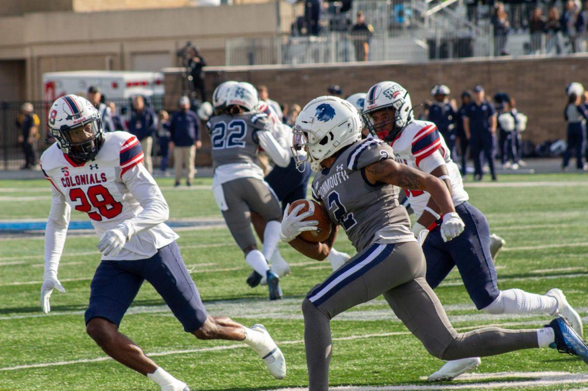 Juwon Farri carries the ball against Robert Morris in West Long Branch on Saturday. 