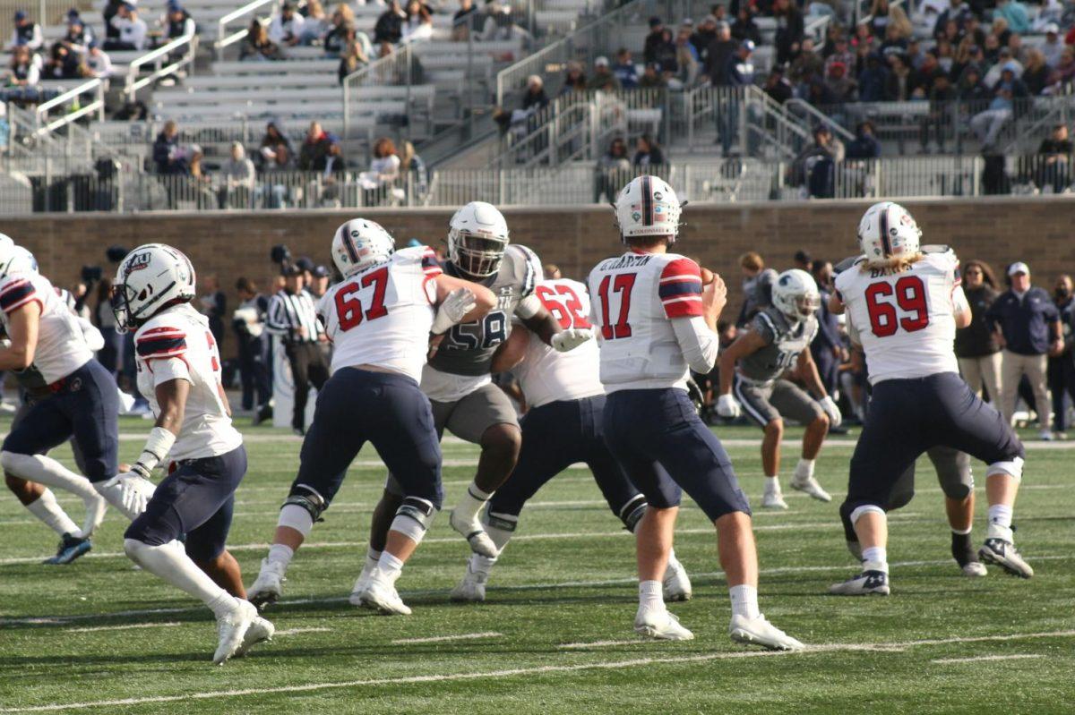 George Martin drops back for a pass against Monmouth. Photo credit: Jonathan Hanna