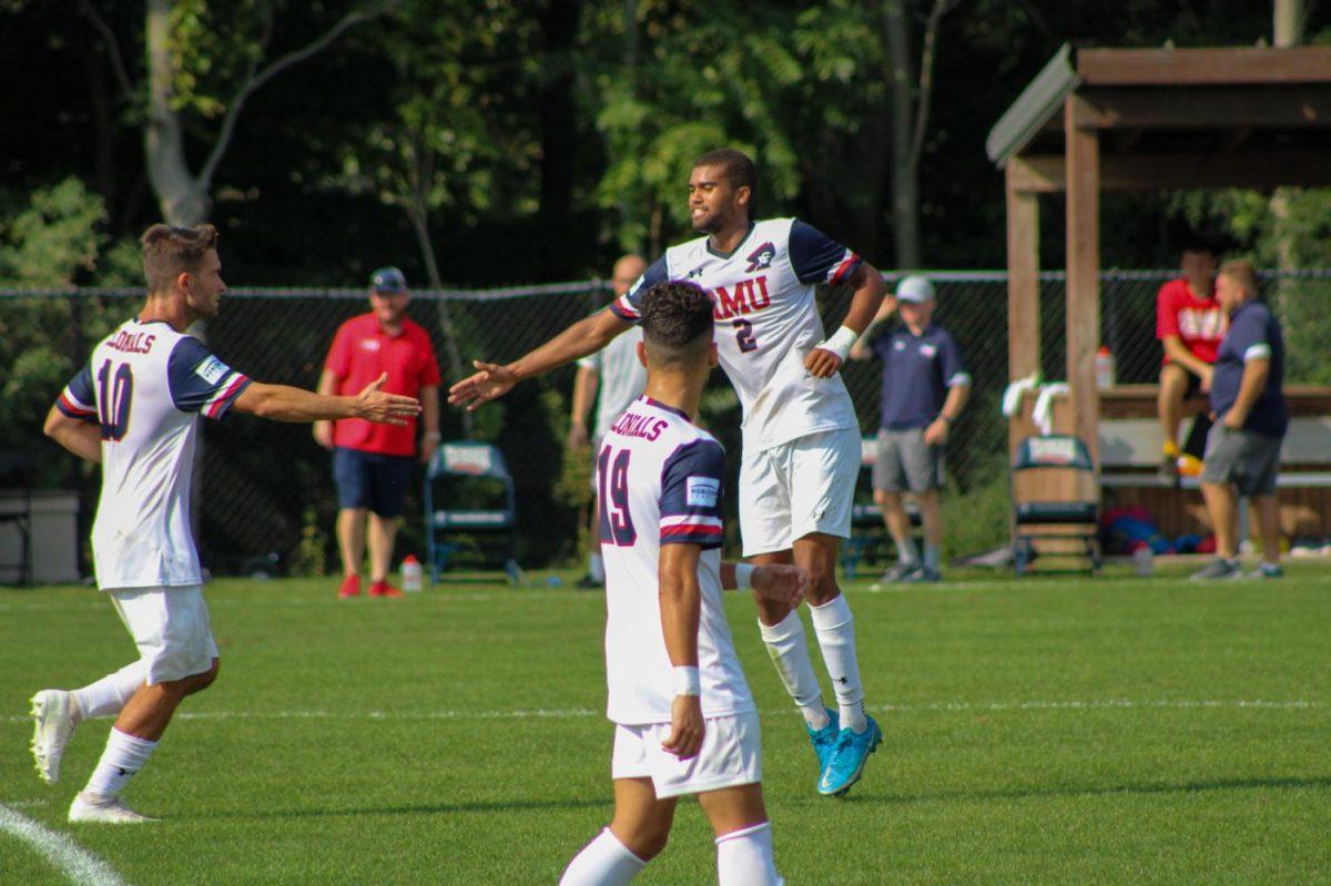 Noe Bijou high-fives Lorenzo Guagneli against Milwaukee. Photo credit: Tyler Gallo