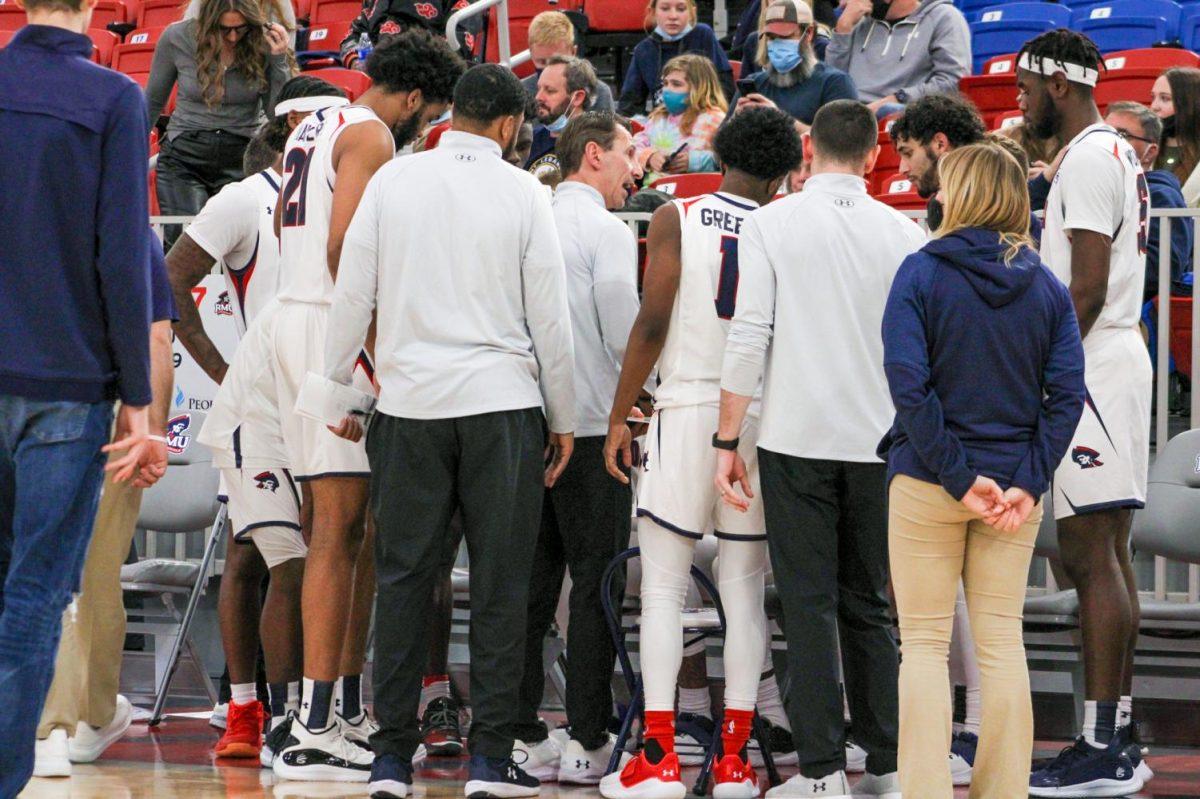 Mens basketball talks during their game against Lancaster Bible. Photo credit: Tyler Gallo