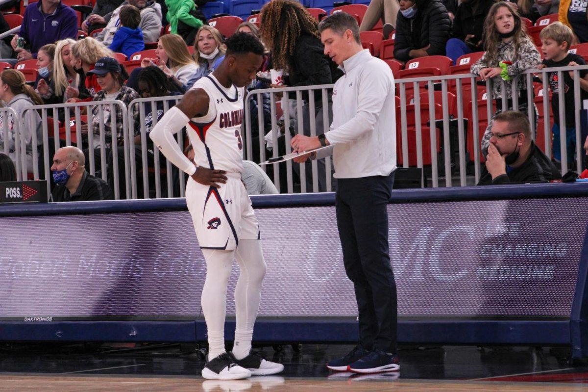 Andy Toole and Rasheem Dunn go over strategy against Lancaster Bible. Photo credit: Tyler Gallo