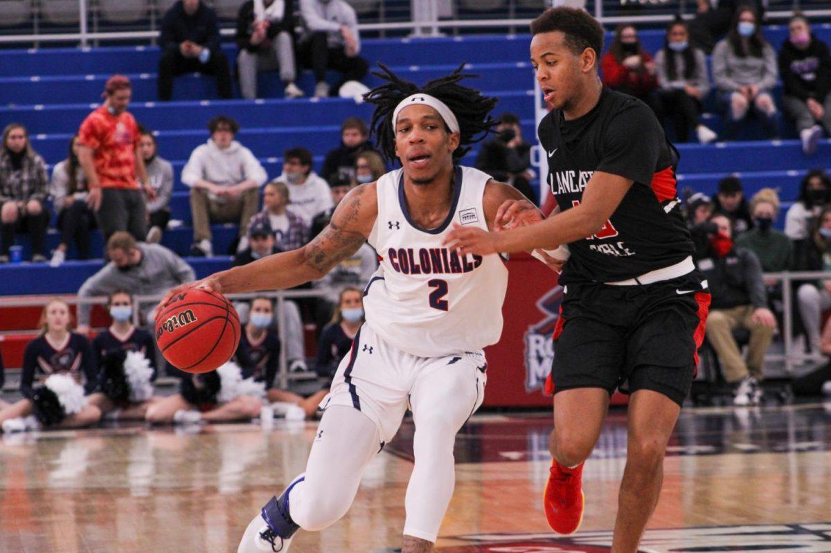 Kahliel Spear drives against Lancaster Bible College. Photo credit: Tyler Gallo