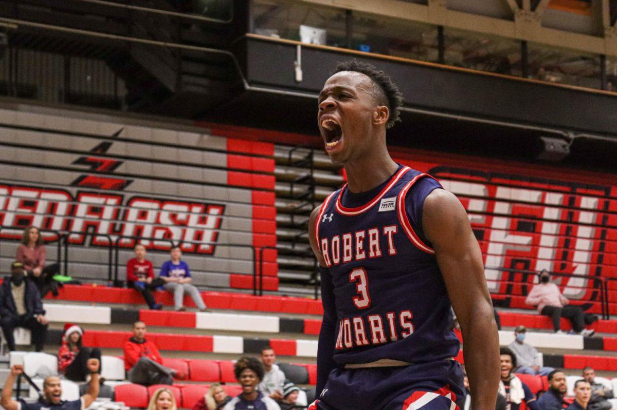 Rasheem Dunn yells after a basket at Saint Francis. Photo credit: Nathan Breisinger