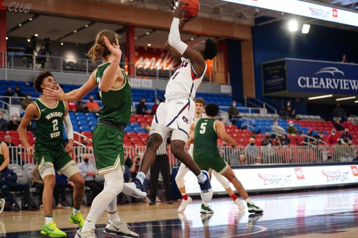 Enoch Cheeks goes up for a layup in the waning seconds of RMUs loss to Wright State. Photo credit: Justin Newton