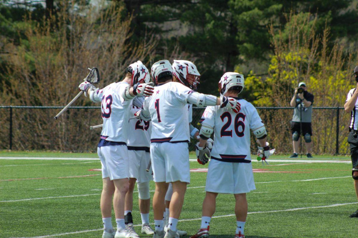 Mens lacrosse celebrates a goal against Cleveland State. Photo credit: Ethan Morrison