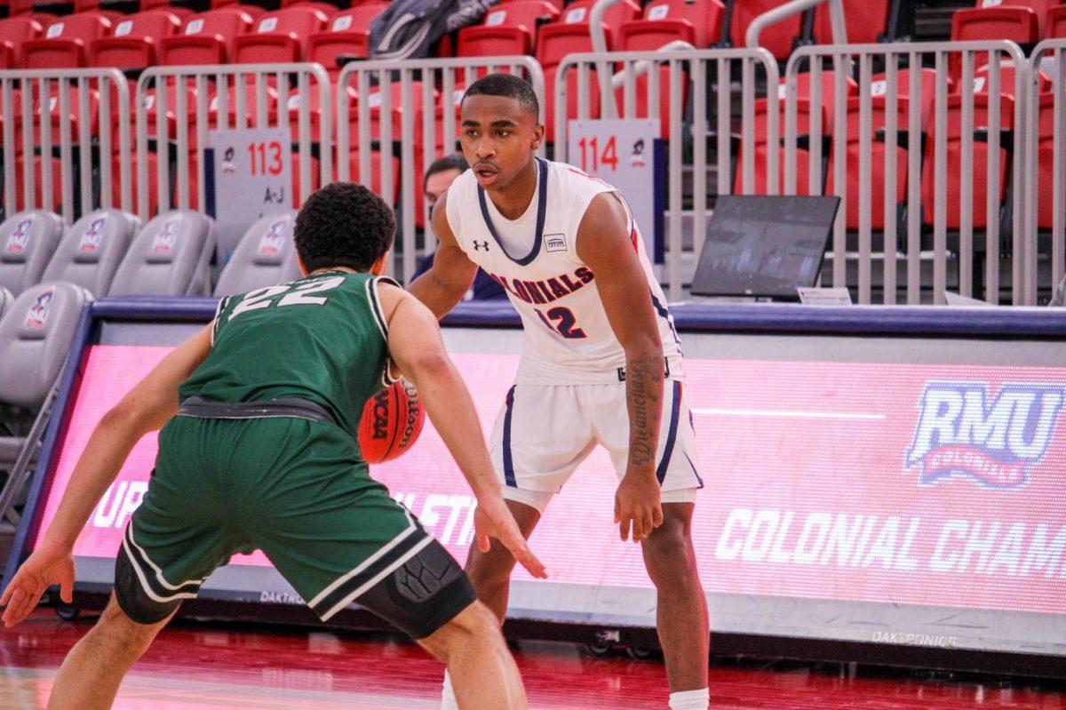 Chase Cook sets up against Deshon Parker of Cleveland State. Photo credit: Tyler Gallo