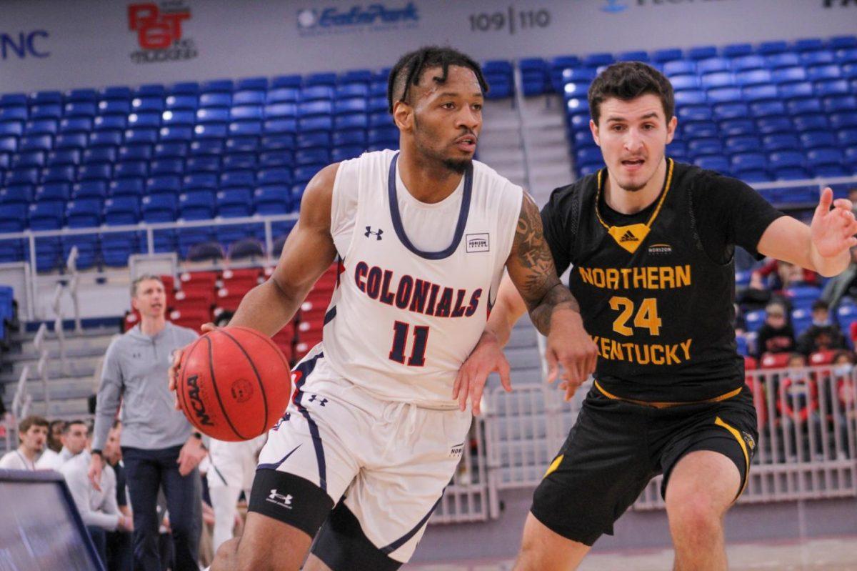 Jaron Williams drives past Jake Evans of Northern Kentucky. Photo credit: Tyler Gallo