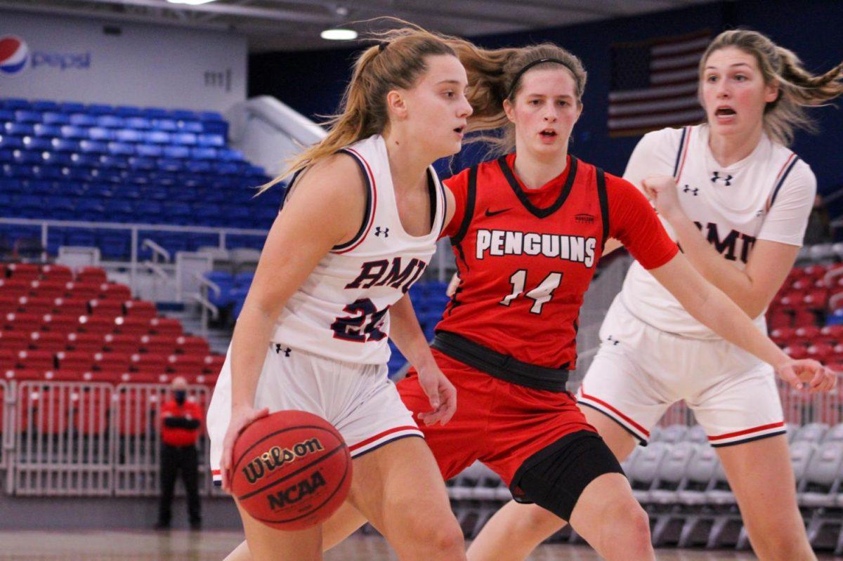 Esther Castedo drives past Chelsea Olson of YSU.