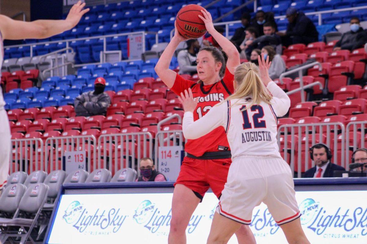 Megan Callahan is guarded by her former teammate Nina Augustin. Photo credit: Tyler Gallo