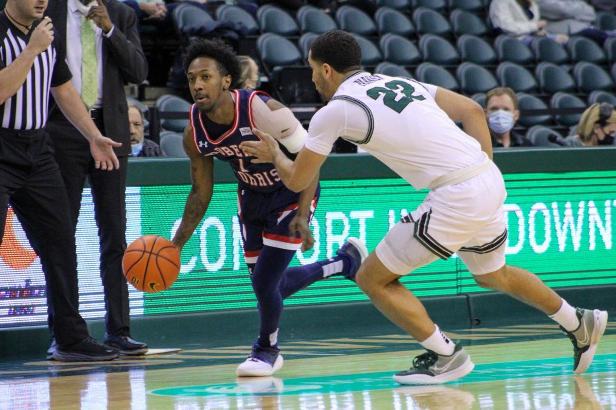 Michael Green III drives past Deshon Parker of Cleveland State. Photo credit: Tyler Gallo