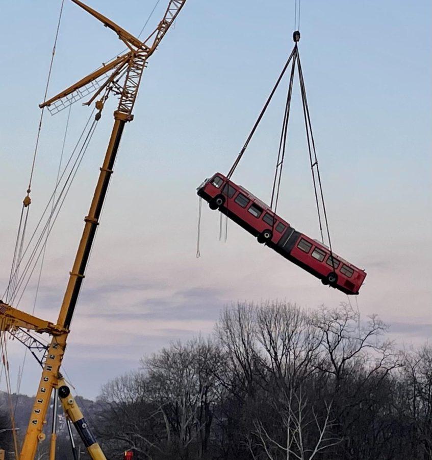 Cranes lifted the Port Authority Bus from the Fern Hollow Bridge Collapse Site on Monday evening.