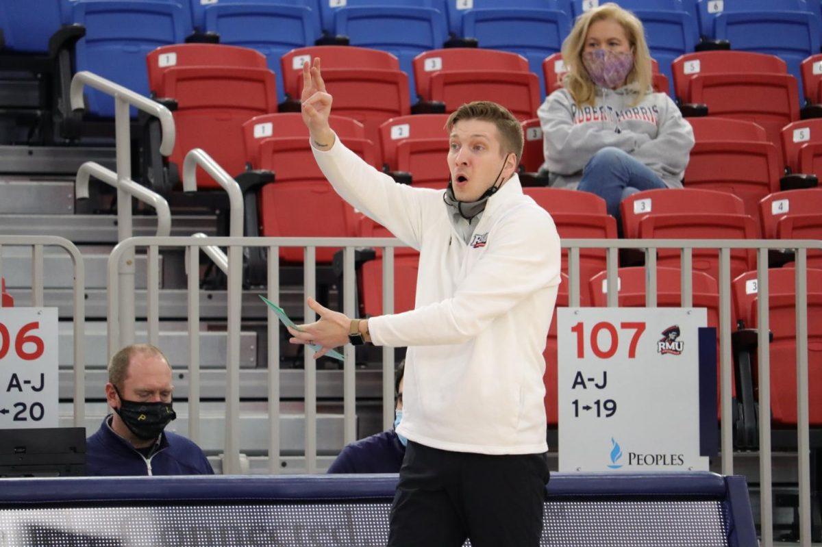 Scott Schneider signals for his team against Purdue Fort Wayne. Photo credit: Ethan Morrison