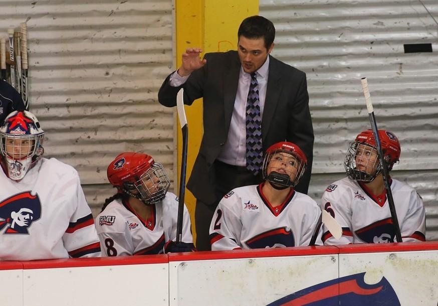 Logan Bittle talks to the womens hockey team. Photo credit: RMU Athletics