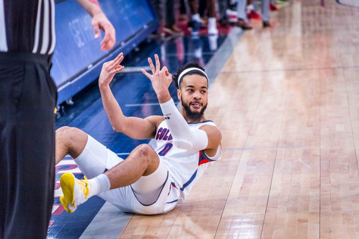 Josh Williams celebrates a three-pointer in the NEC Semifinals against LIU. Photo credit: David Auth