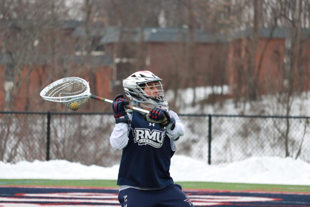 Jamie Keller attempts to clear the ball at practice. Photo Credit: Ethan Morrison