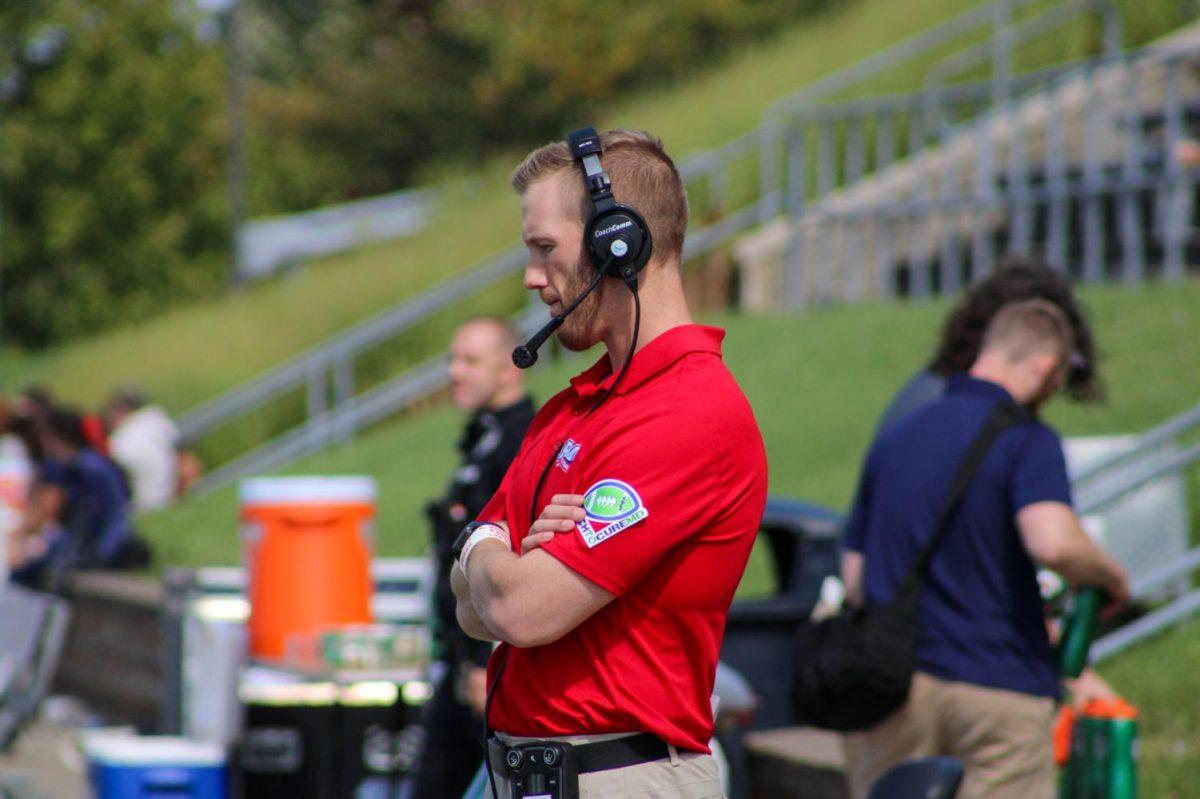 Dave Plungas stands on the sidelines during RMUs game against Howard. Photo credit: Tyler Gallo