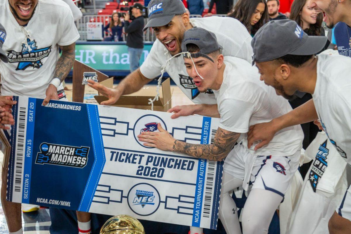 Mens basketball celebrates punching its ticket to March Madness. Photo credit: Thomas Ognibene