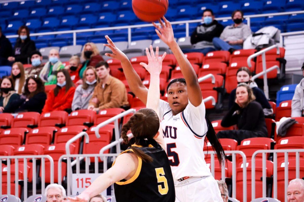 Simone Morris takes a shot over Northern Kentuckys Lindsey Duvall in the teams 64-49 loss on senior day. Photo credit: Ethan Morrison