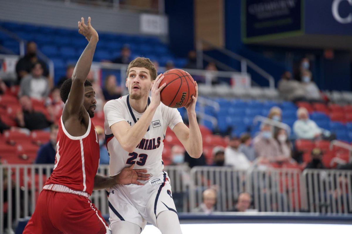 Brandon Stone fights off an IUPUI player. Photo credit: Justin Newton