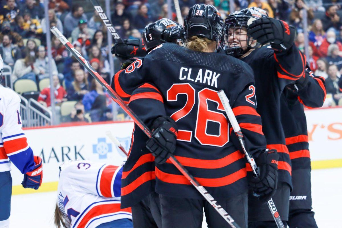 Team Canada celebrates a goal. Photo Credit: Ethan Morrison