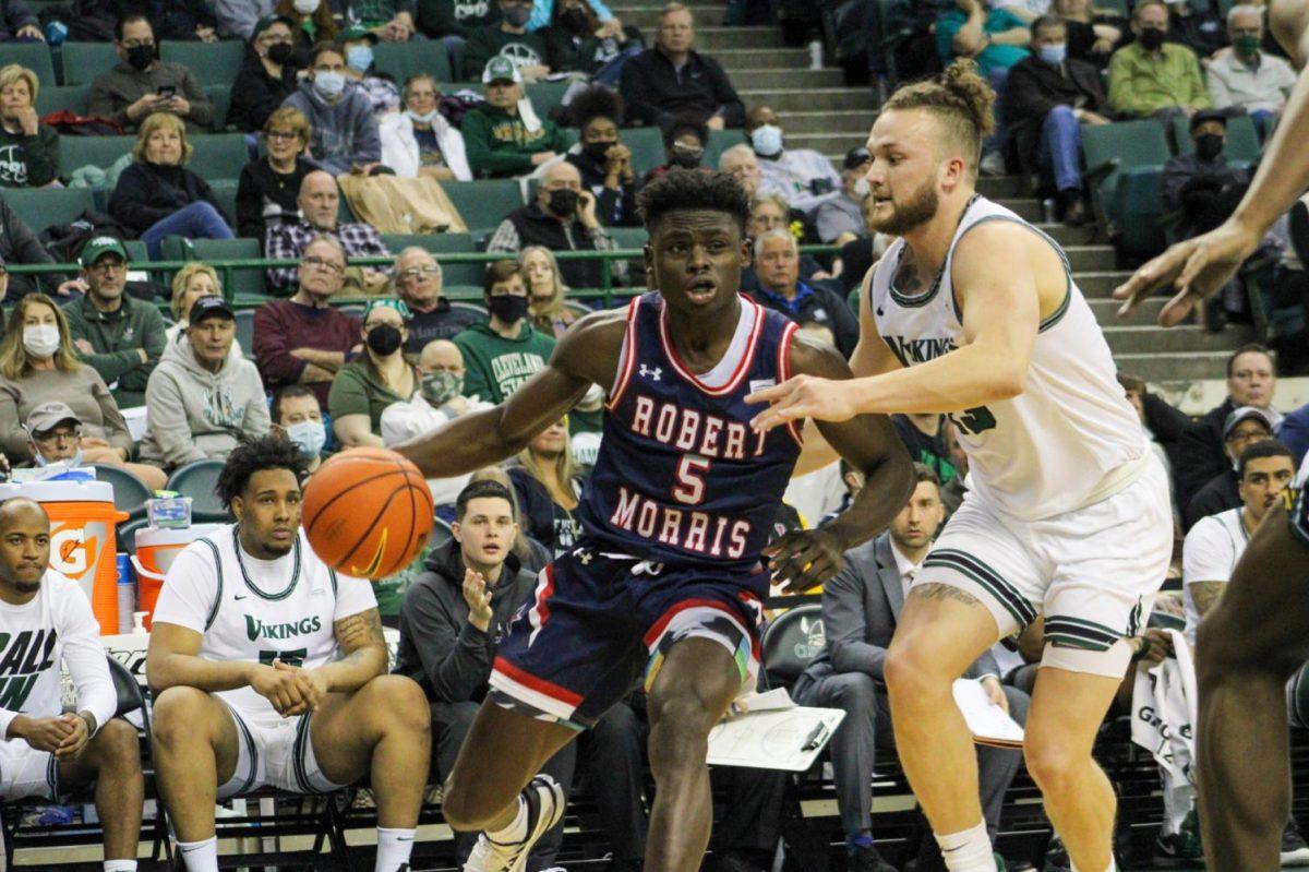 Enoch Cheeks is hounded by Broc Finstuen of Cleveland State.