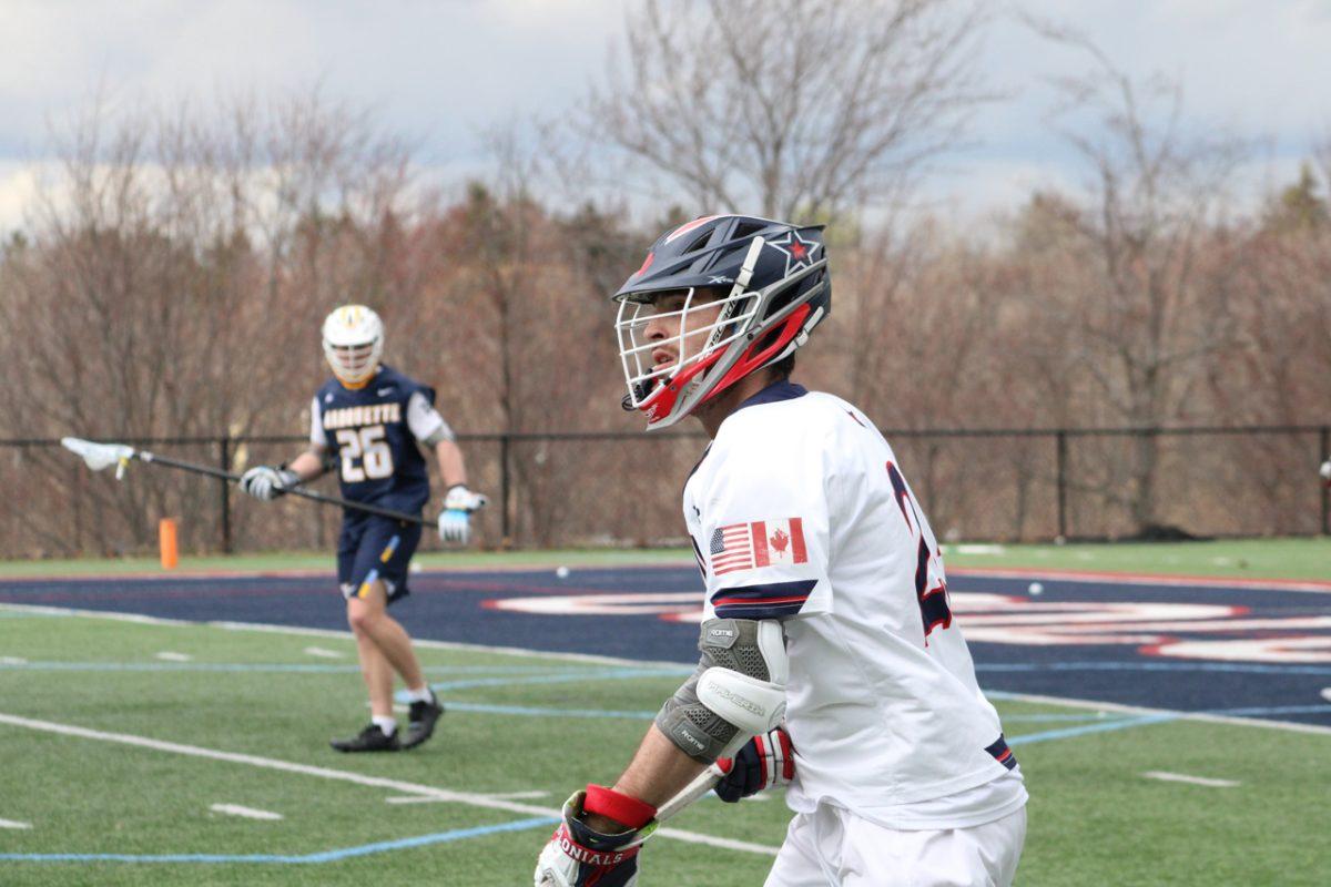 Corson Kealey fires a pass against Marquette. Photo credit: Tyler Gallo