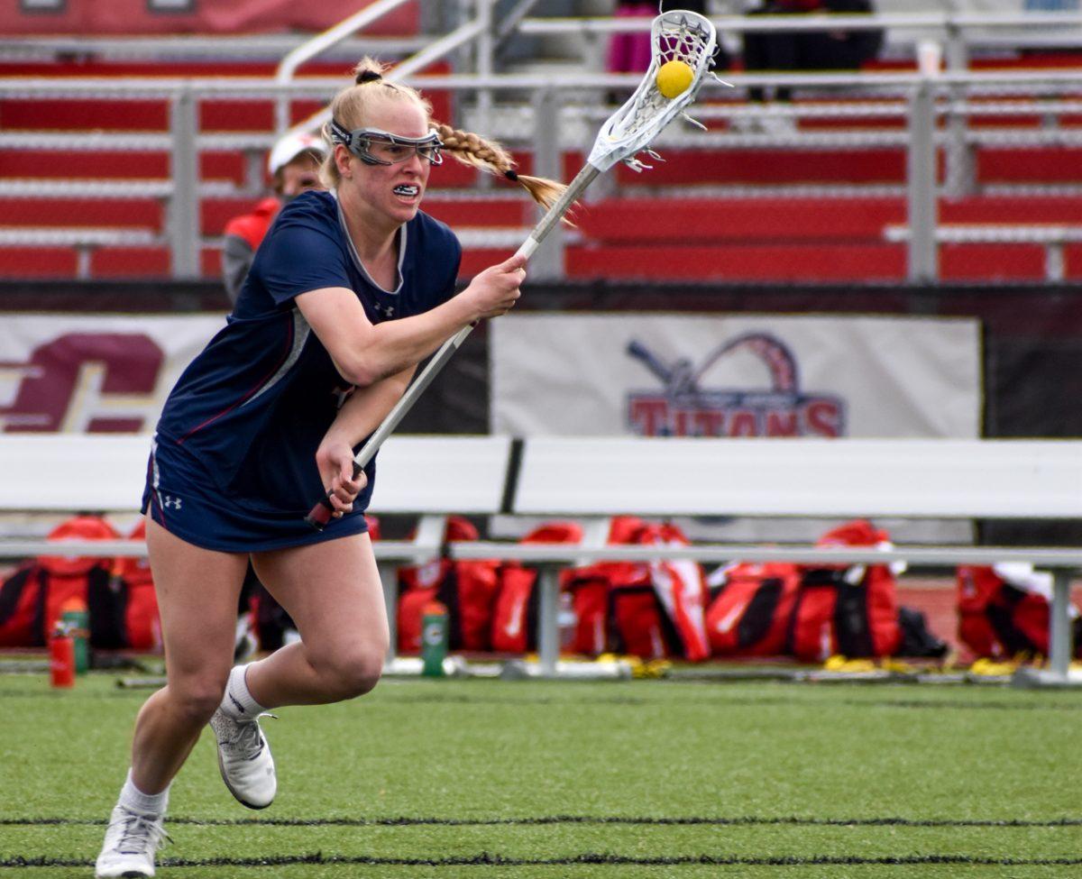 Jenna Irwin carries the ball against Youngstown State. Photo credit: Megan Frey