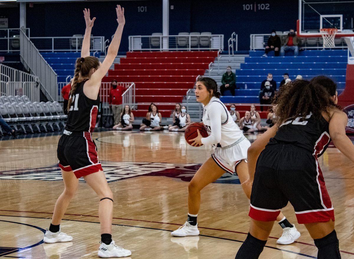 Natalie Villaflor looks for a lane against IUPUI. Photo credit: Gabriella Rankin