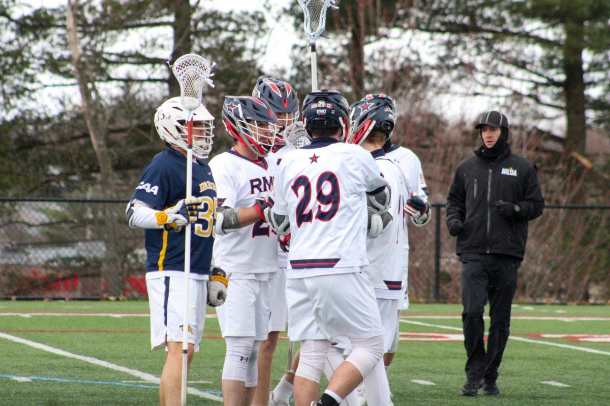 Mens lacrosse celebrates a goal against Drexel. Photo credit: Cameron Macariola