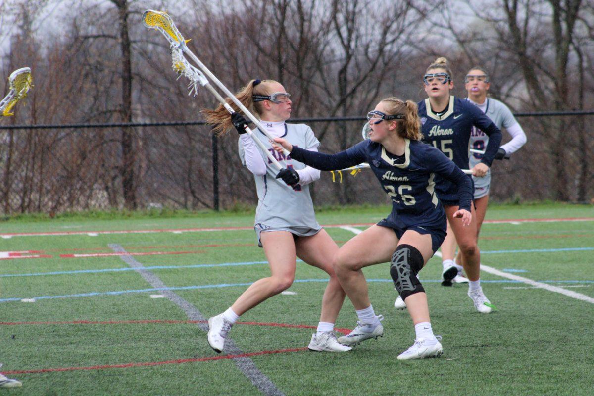 Jenna Irwin is accosted by Akrons Antonia Trickett in RMUs win over the Zips. Photo credit: Tyler Gallo