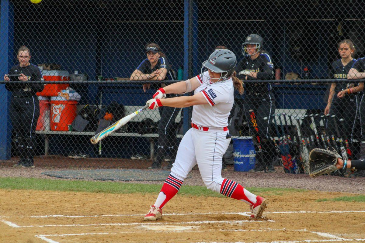 Erika Bell swats a triple against Purdue Fort Wayne. Photo credit: Cameron Macariola